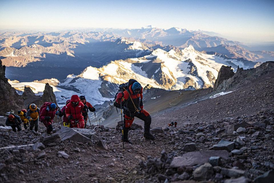 people in summit suits during aconcagua summit day
