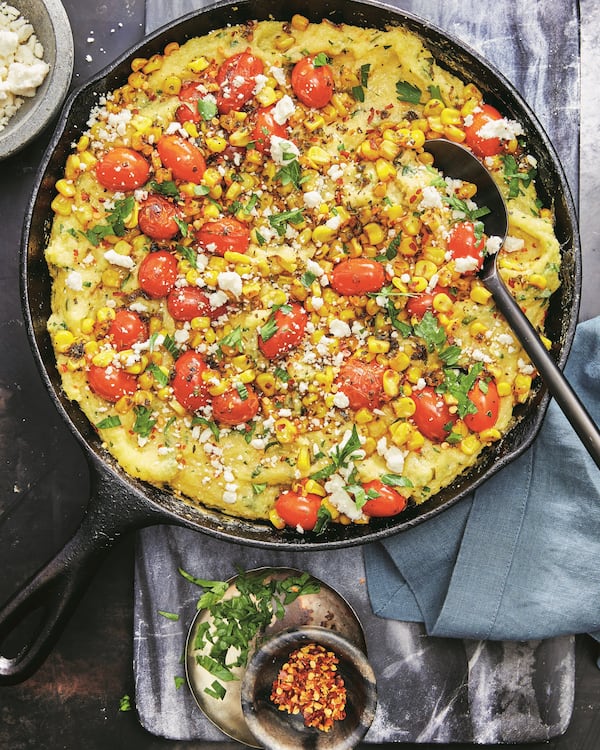 Skillet Corn-and-Tomato Baked Polenta makes a great meatless meal when paired with a green salad, or an elevated side dish to a meaty main.
 
Reprinted with permission from “The Mediterranean Dish: Simply Dinner” by Suzy Karadsheh, copyright© 2024. Photographs by Caitlin Bensel. Published by Clarkson Potter, a division of Penguin Random House, LLC.