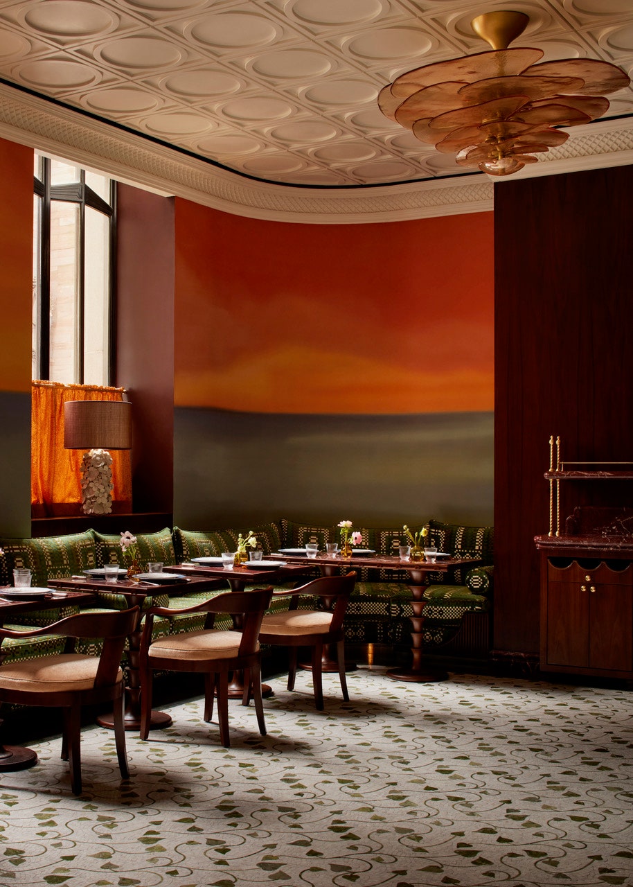 Image may contain Indoors Interior Design Lamp Architecture Building Dining Room Dining Table Furniture and Room