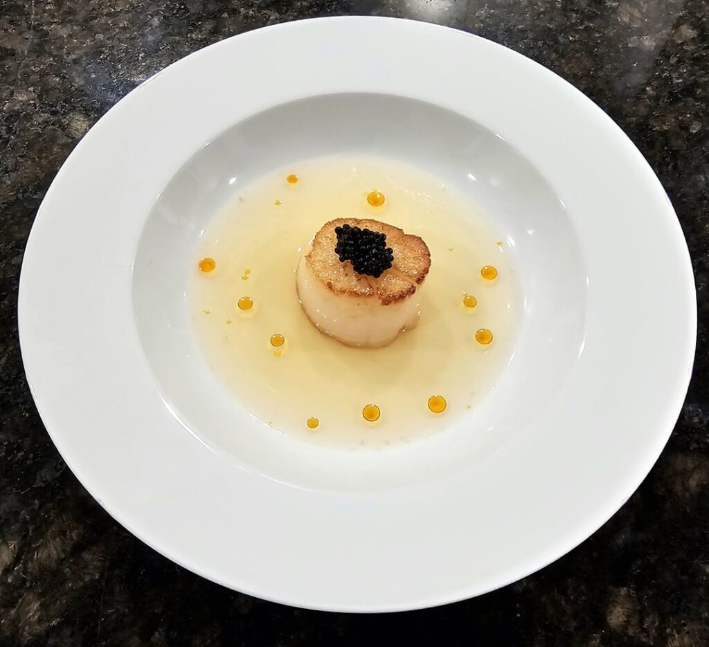 Seared Weathervane scallop, bacon-yuzu dashi, seaweed pearls, chili oil