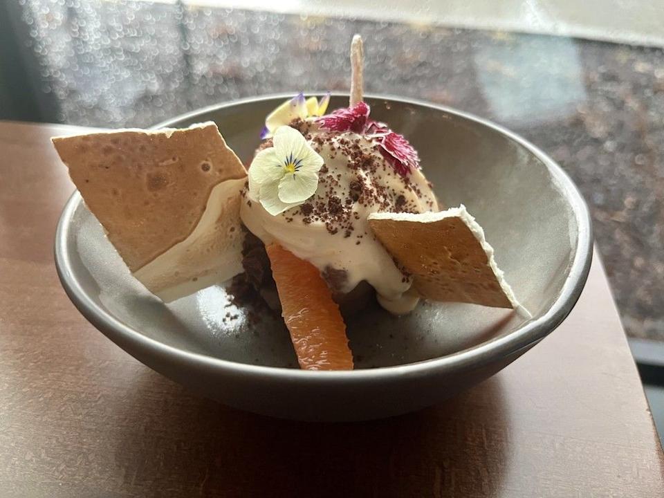 Dark chocolate mousse with milk chocolate cointreau anglaise and meringue at Elise in Westboro.