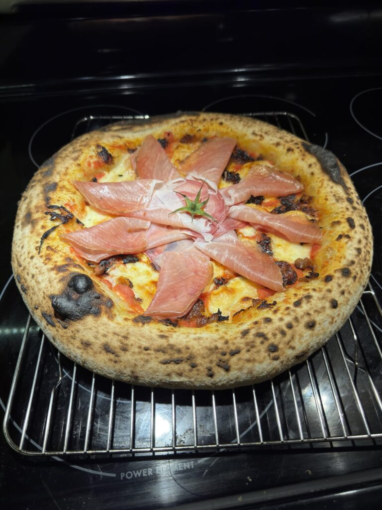 Fresh mozzarella, smoked prosciutto, caramelized onion on basil infused fresh San Marzano tomato sauce