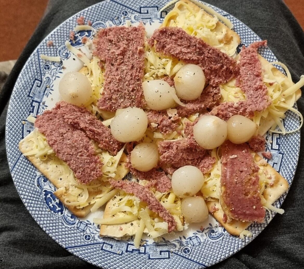 Crackers, corned beef, cheese and onion.