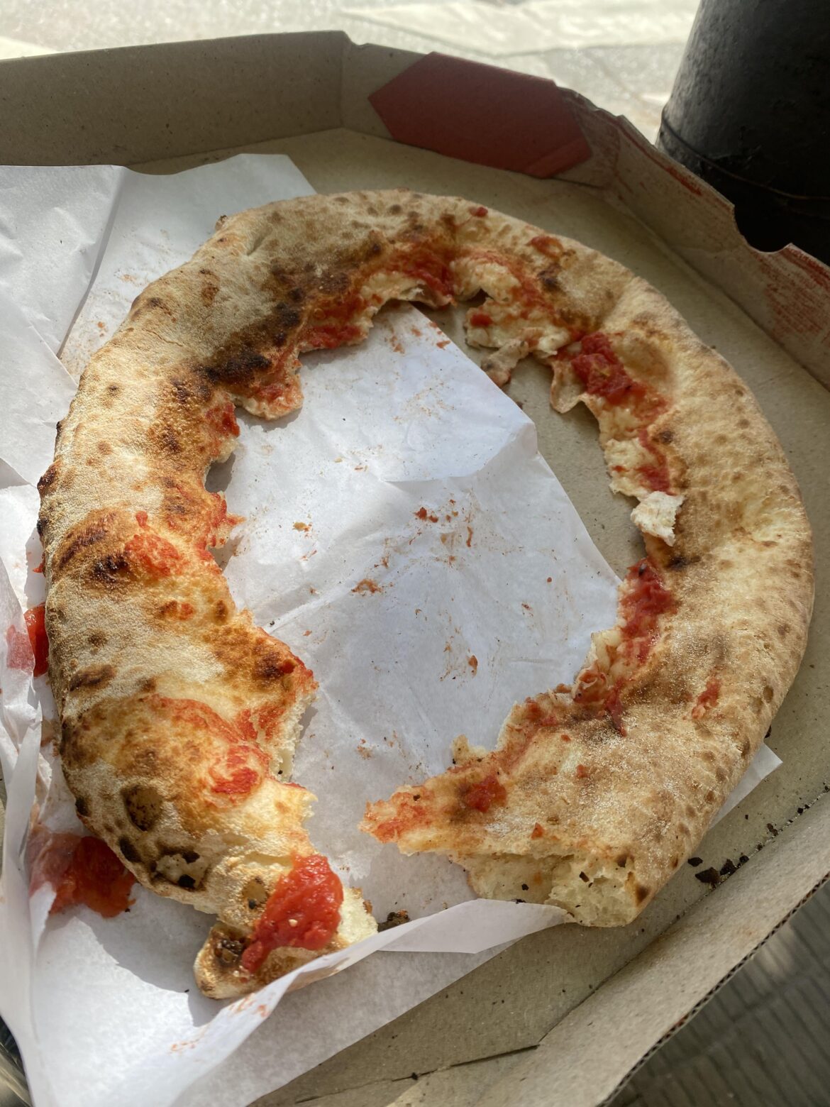 Someone ate pizza and left it like this on the streets….