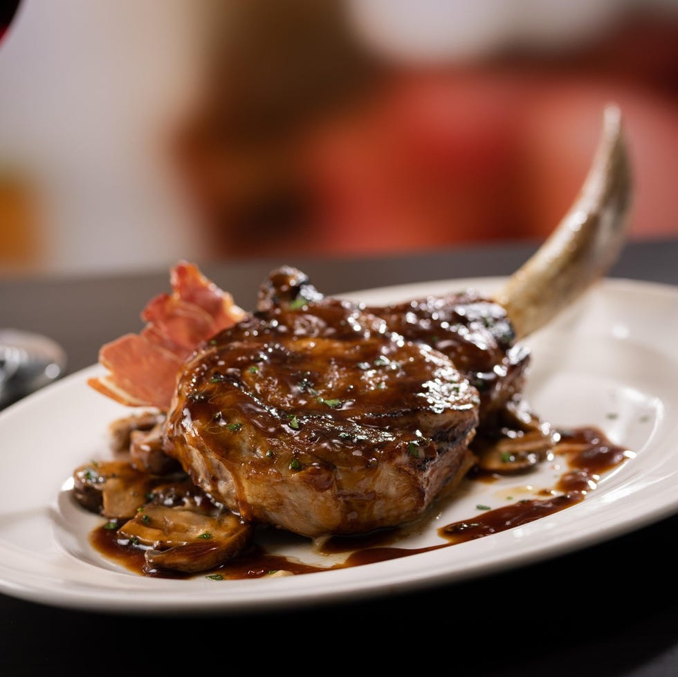 bone in tomahawk veal chop on plate