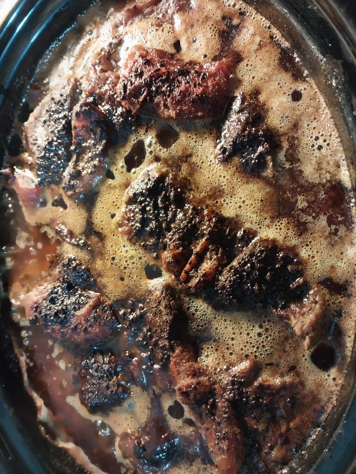 10lbs of beef chuck simmering in my "secret sauce", this is 8hrs in.