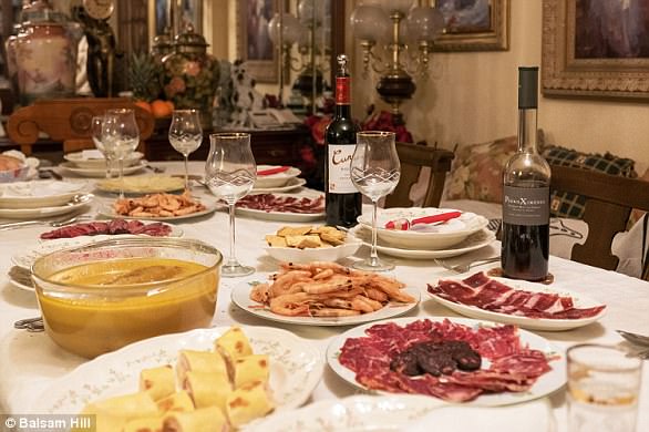 A typical Spanish Christmas table, featuring plenty of cold meats and shrimp