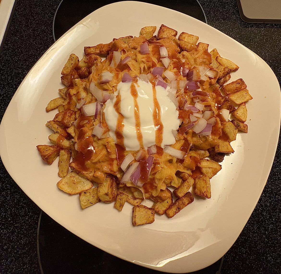 giant plate of chili cheese potatoes for 475 calories