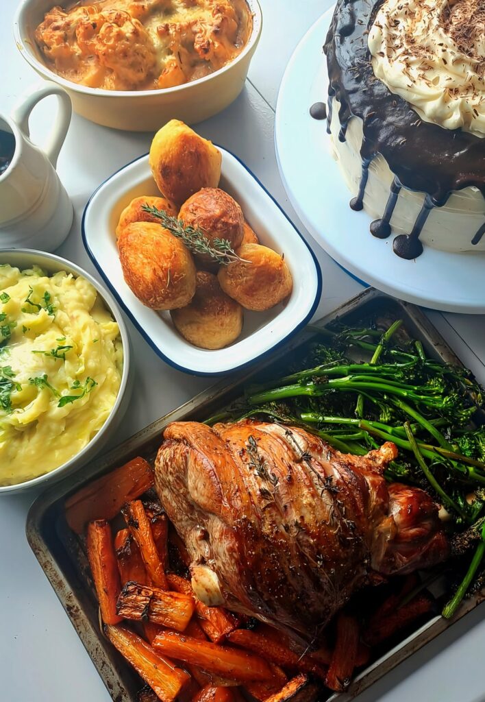 Roast leg of lamb with honey roasted carrots, fried tenderstem broccoli, colcannon, roast potatoes and cauliflower cheese served with a guinness chocolate cake with baileys cream cheese frosting