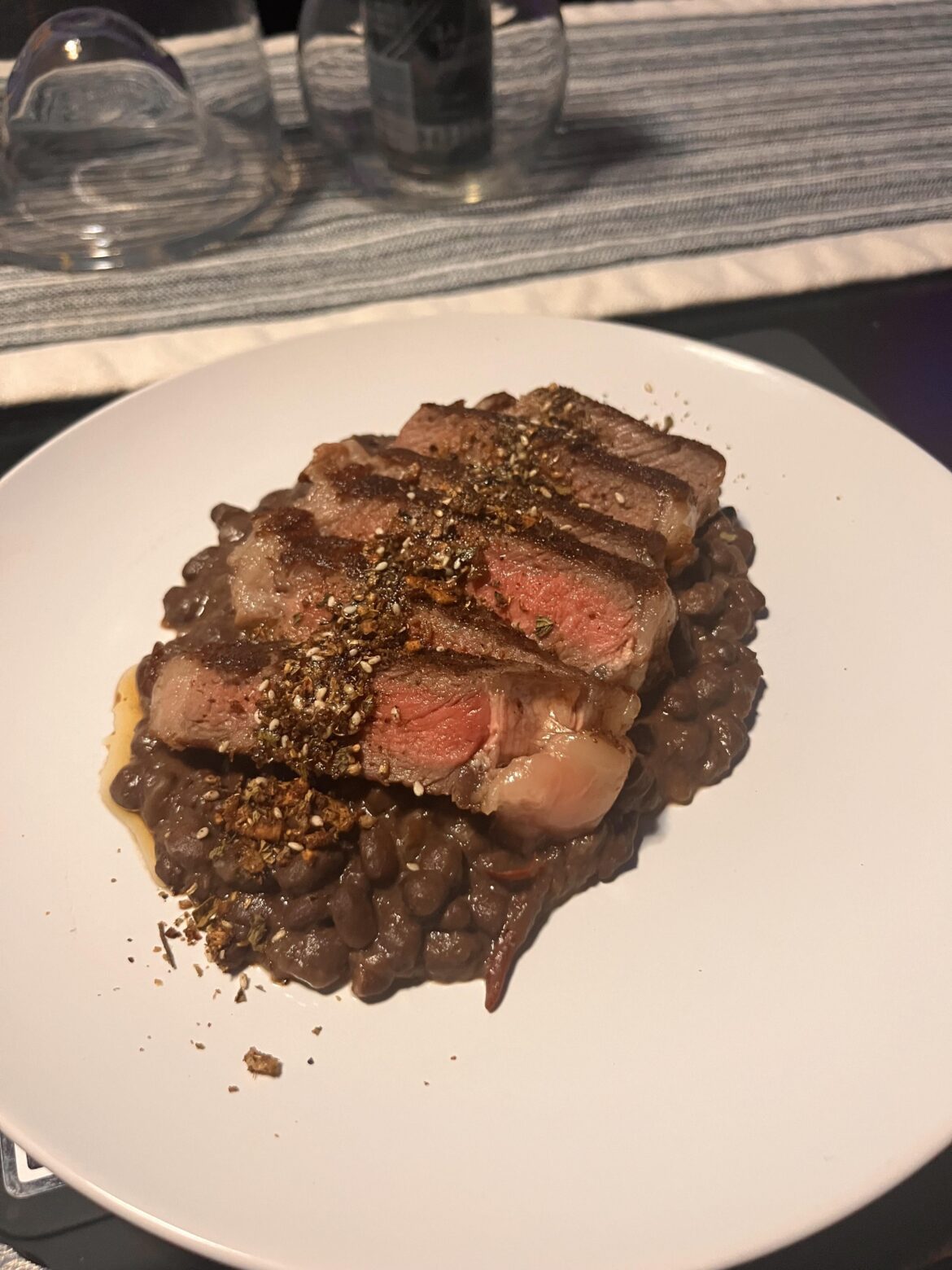 Butter basted ribeye and refried black beans.