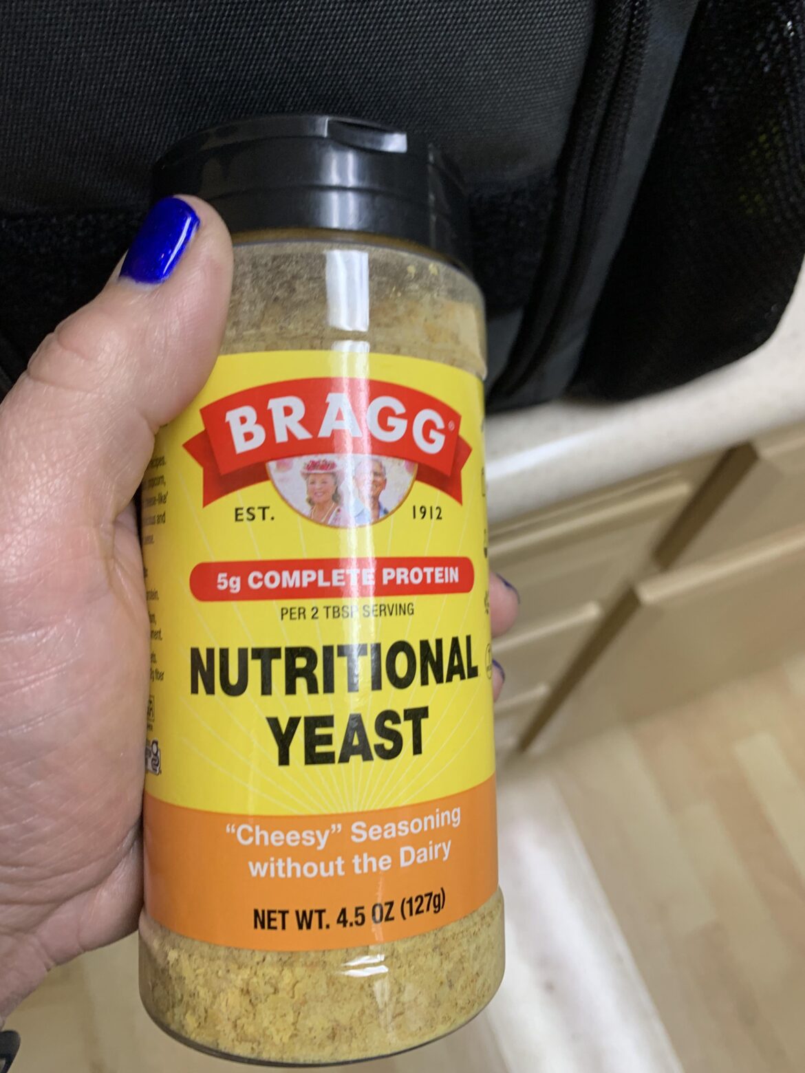 How do you get your nutritional yeast to stick to your popcorn?