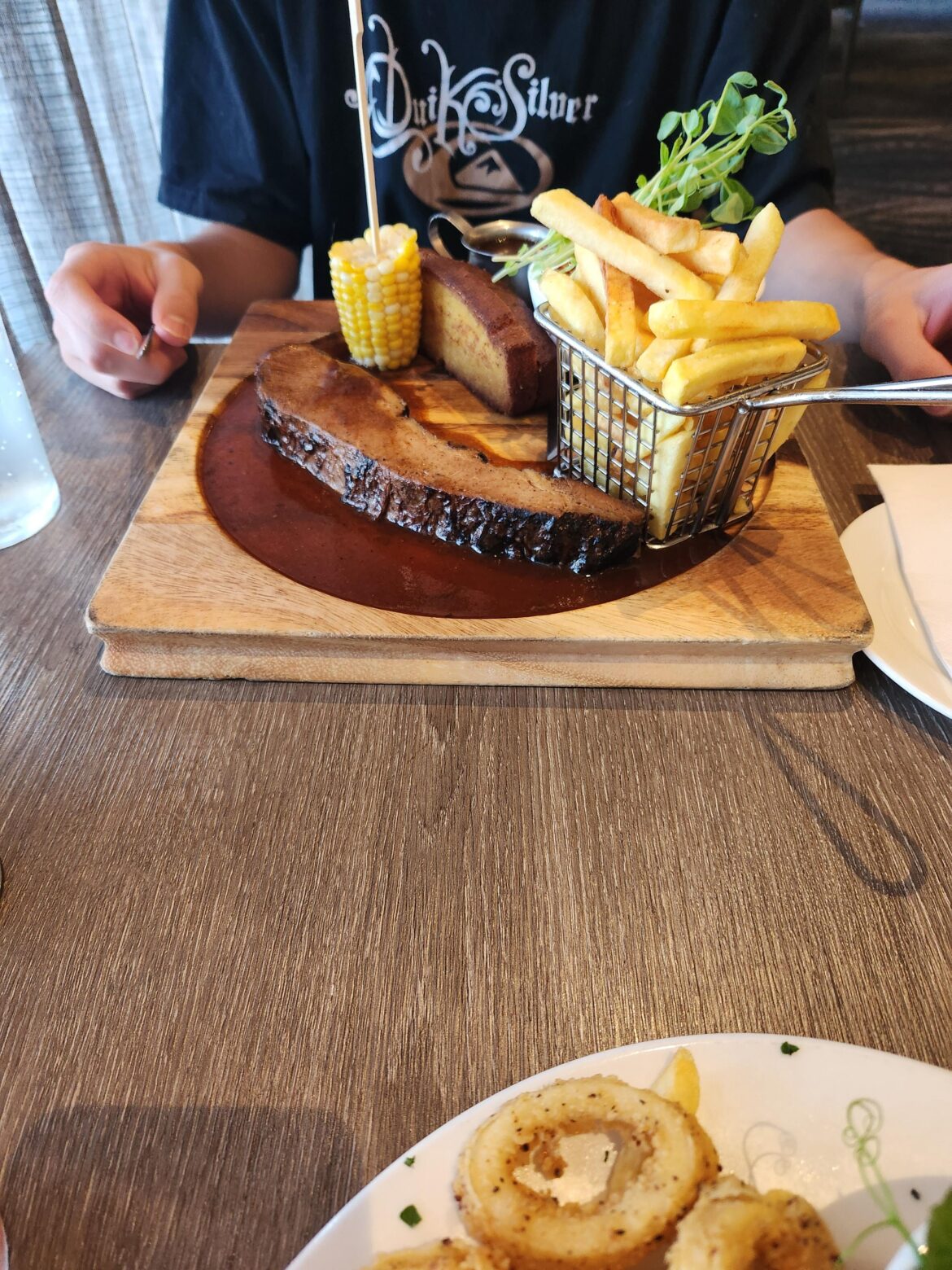 Texas Style Beef Brisket. Note the circular indent designed to contain the gravy. 🙄 A plate would have been perfectly acceptable as it spilled over anyway.