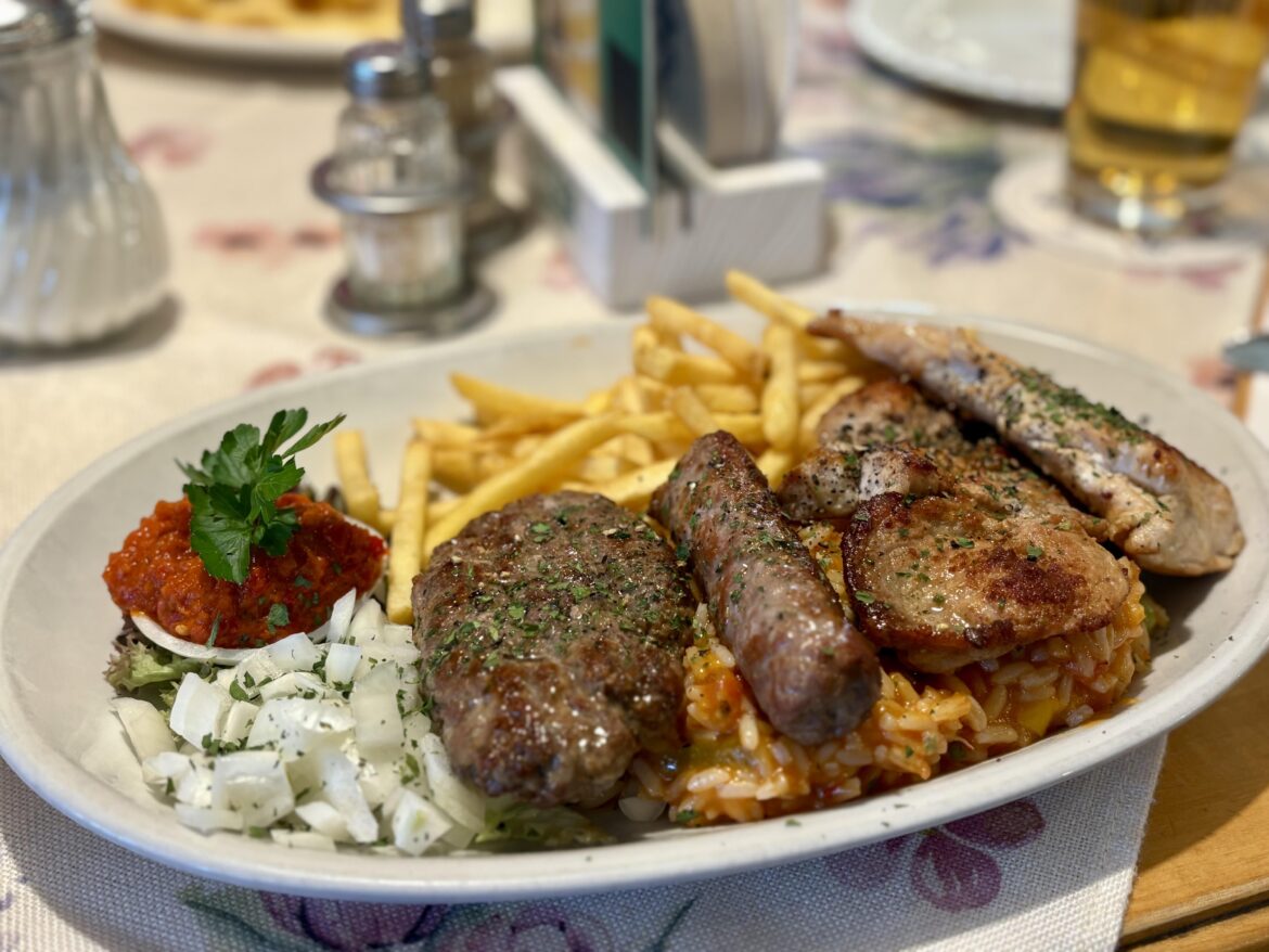 Mix-Grillteller with rice, French fries and Ajvar