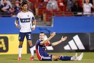 FC Dallas forward Petar Musa (9) looks for a penalty call after being tackled alongside...