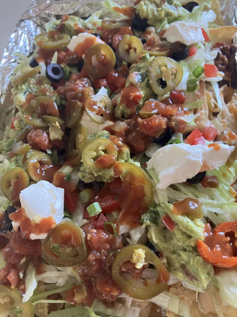 Made our kids tacos last night for movie night while wife was out of town. Today my parents have our kids, so my wife and I had sheet pan nachos for lunch after a few bloody Mary’s and screwdrivers.  She likes them with guacamole & sour cream on the side.  I like them with it all. Nap is imminent.