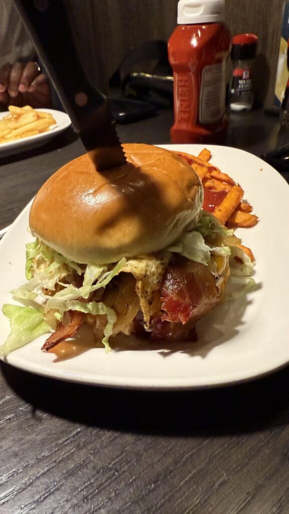 Southern charm burger w/fried egg abs and Lava Queso burger from Red Robin