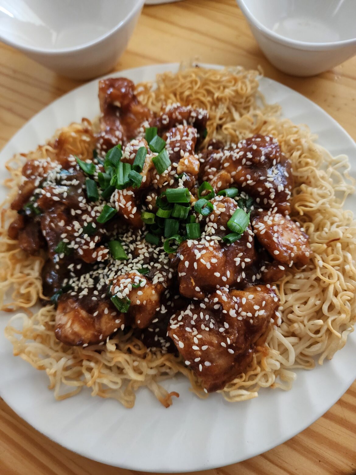 Dark Meat Sesame Chicken over Pan-Fried Noodles (yum)