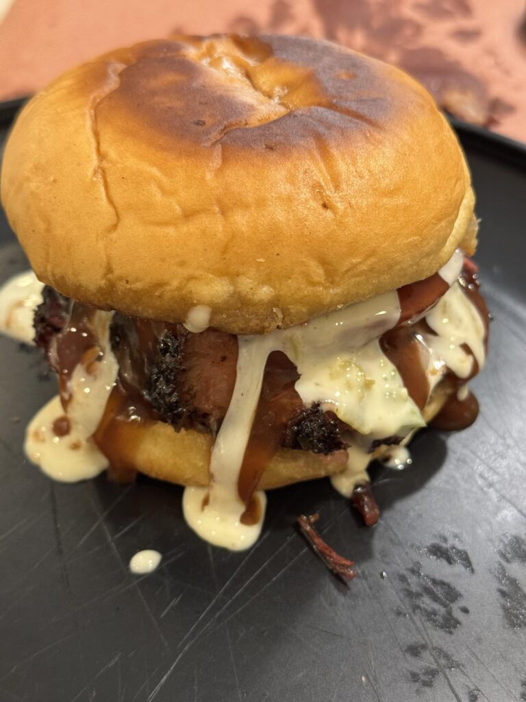 Point Brisket, Jalapeño Cheddar Sausage, Queso and Bbq sauce Sammy!