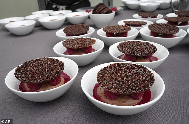 Light chocolate raspberry mousse and crunchy tuile dishes of French chef Stephane Chicheri chief executive of Sodexo Live are displayed. The company has been tasked with serving 40,000 meals a day at the Olympic Village