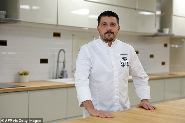 Executive chef for the Olympic Village of the Paris 2024 Olympic and Paralympic Games, Charles Guilloy from Sodexo Live!, poses in Rungis, near Paris