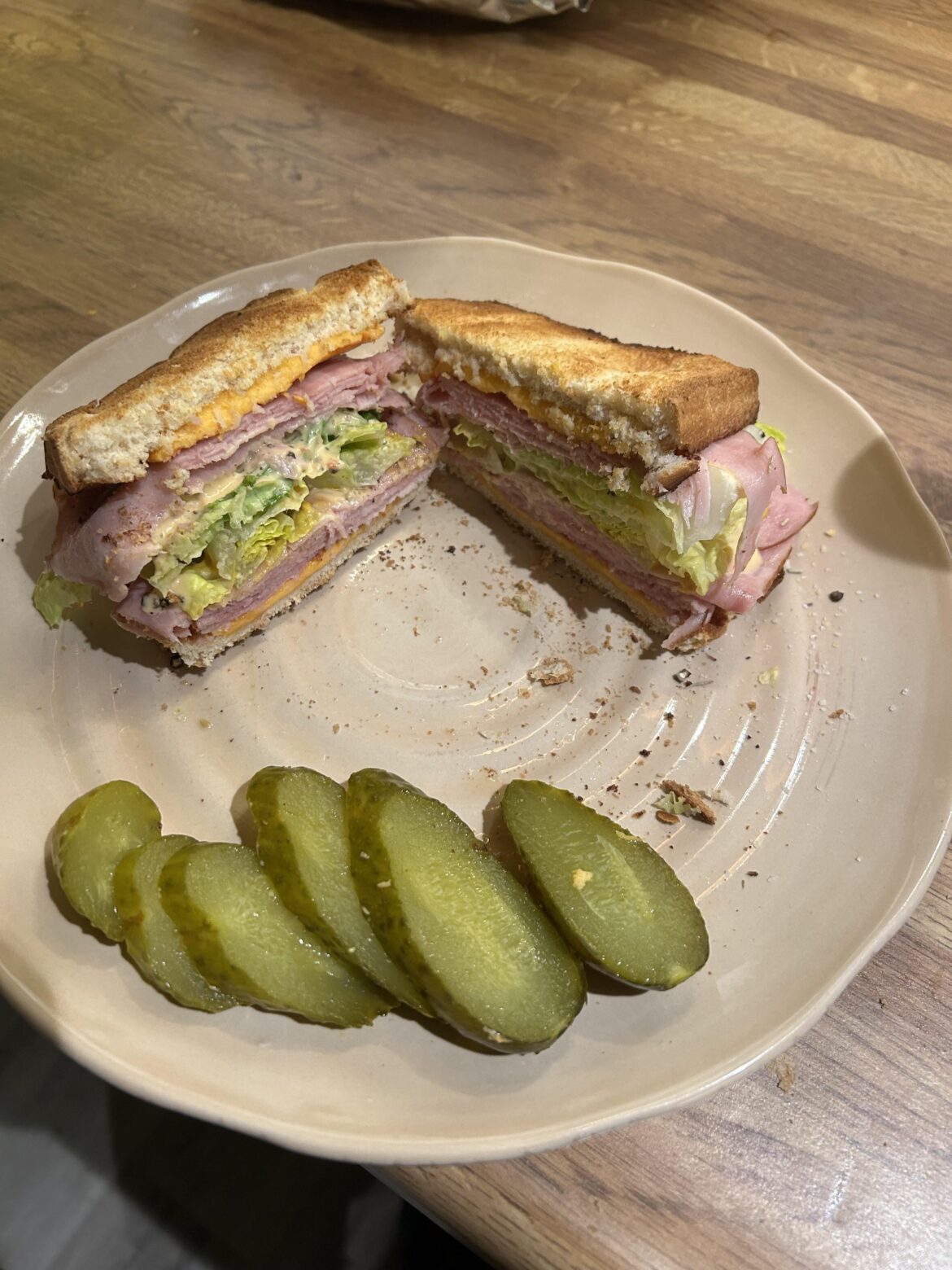 Wonderbread, old cheddar, ham,Lettuce, mayo, hot sauce,lettuce, ham, cheeese, wonderbread