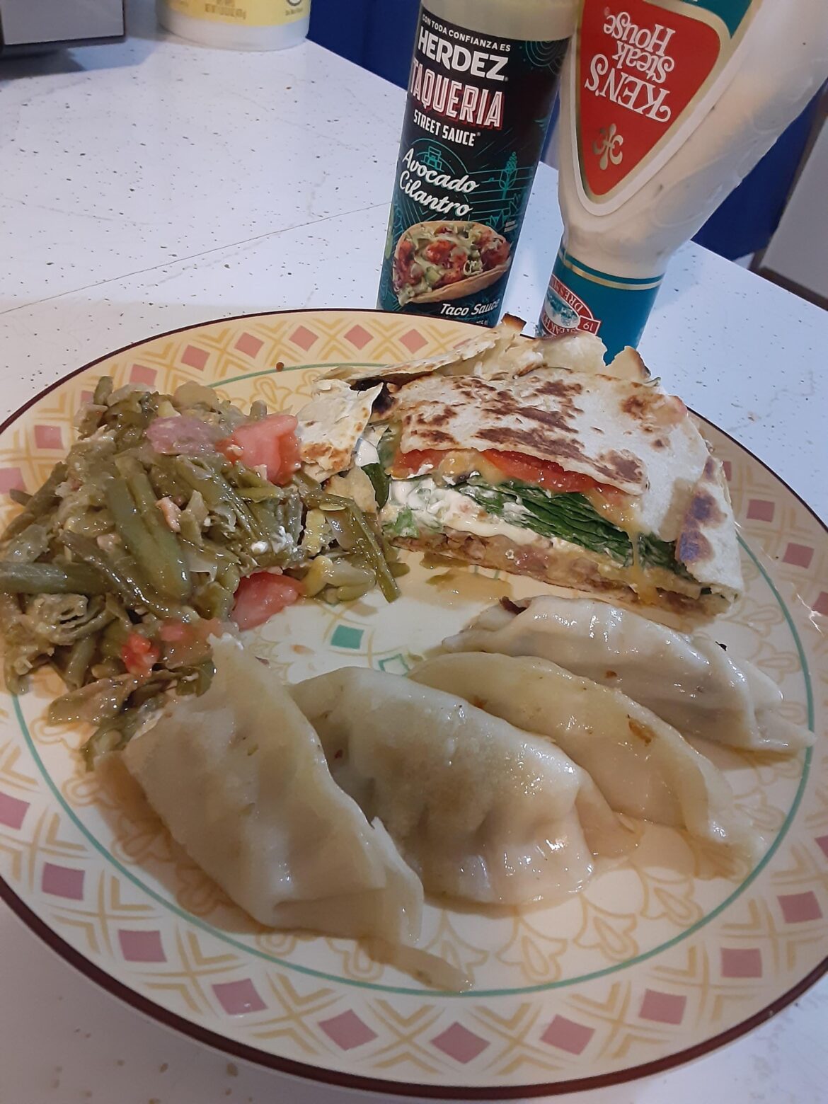 Homemade crunchwrap, sautéed green beans and pork potstickers. Extra side of genesee or a few..