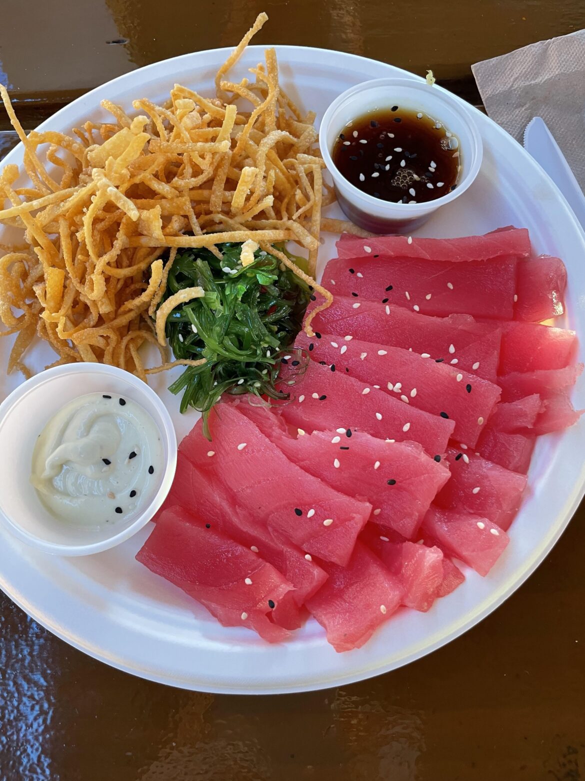Eating sashimi everywhere, even on a paper plate in Florida.