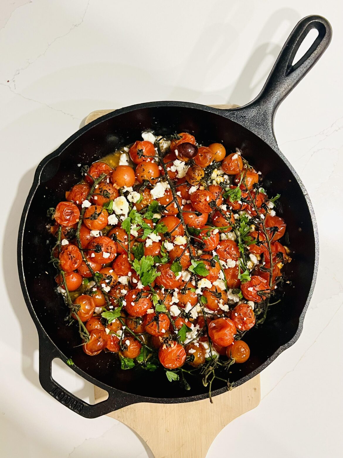 [OC] Oven-roasted tomatoes with feta. Simple food, big flavor.
