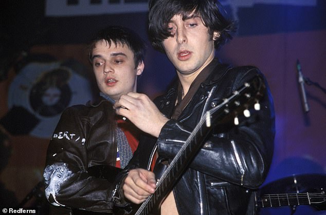 Doherty and Carl Barat (right) were co-frontmen of the Libertines - the pair are pictured here during the group's heyday, peforming at the Forum in Kentish Town, north London