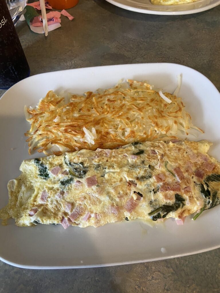 How many calories would you guess is in this breakfast? Egg white omelette, hash browns and whole wheat toast.