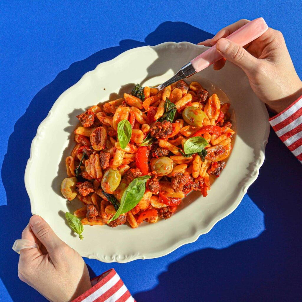Cavatelli - a southern Italian pasta served with caramelized pork sausage, Calabrian chilli, pickled bell peppers, and green olives