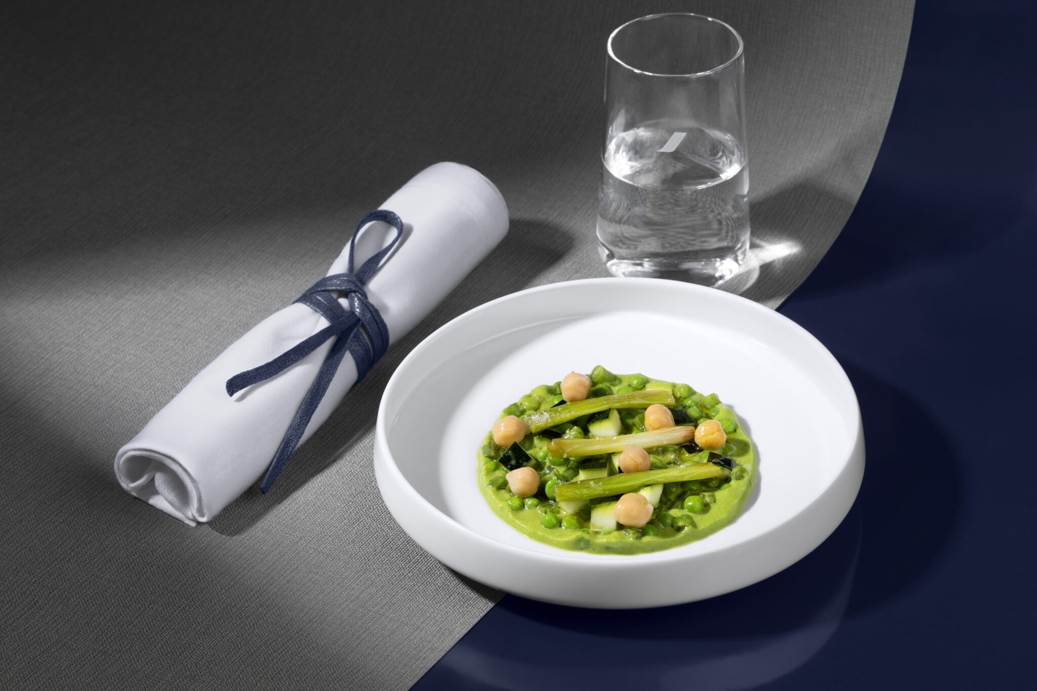 A. Lallement Air France Business dish displayed on white dishes and a blue table runner.