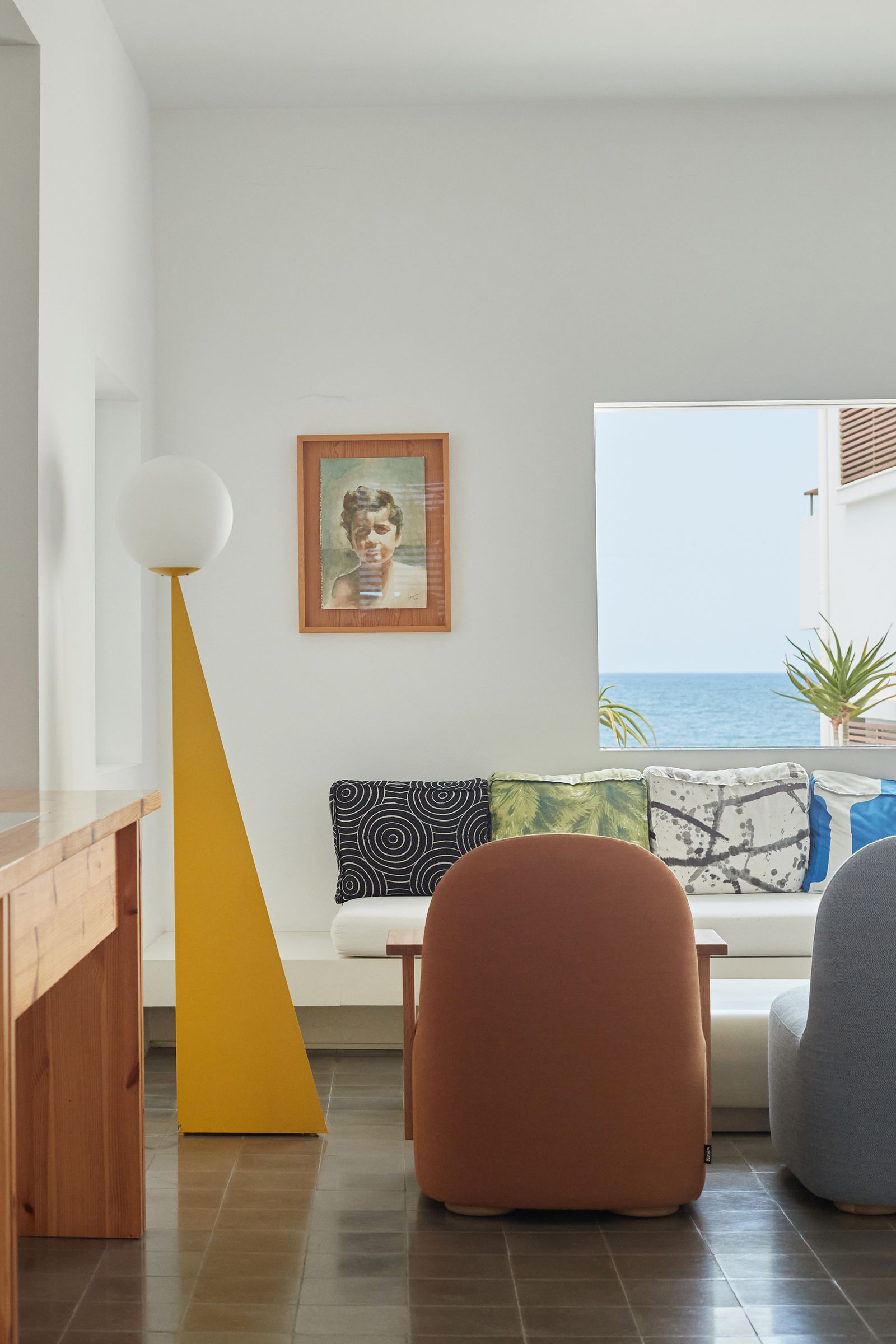 Image may contain Lamp Art Painting Person Furniture Architecture Building Indoors Living Room Room and Chair