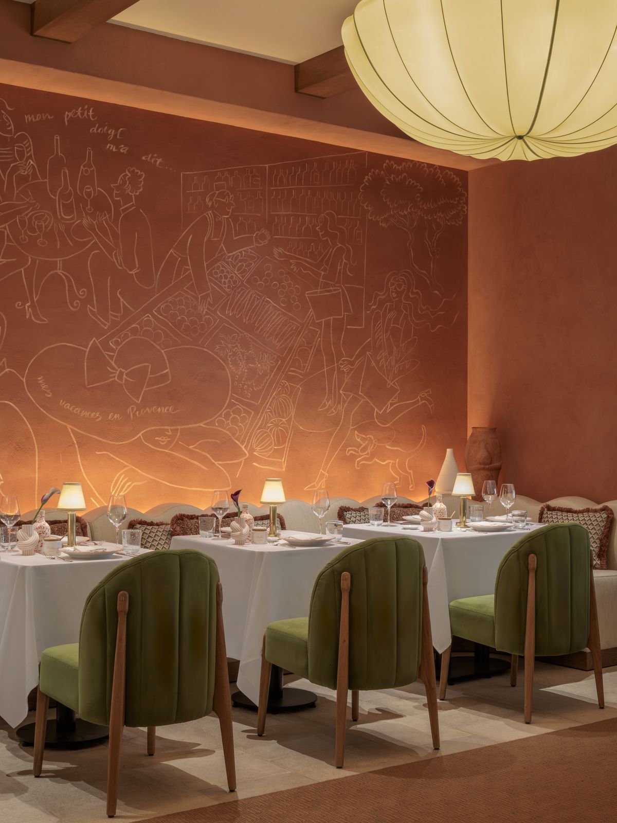 A large drawing on a coral-colored wall. 