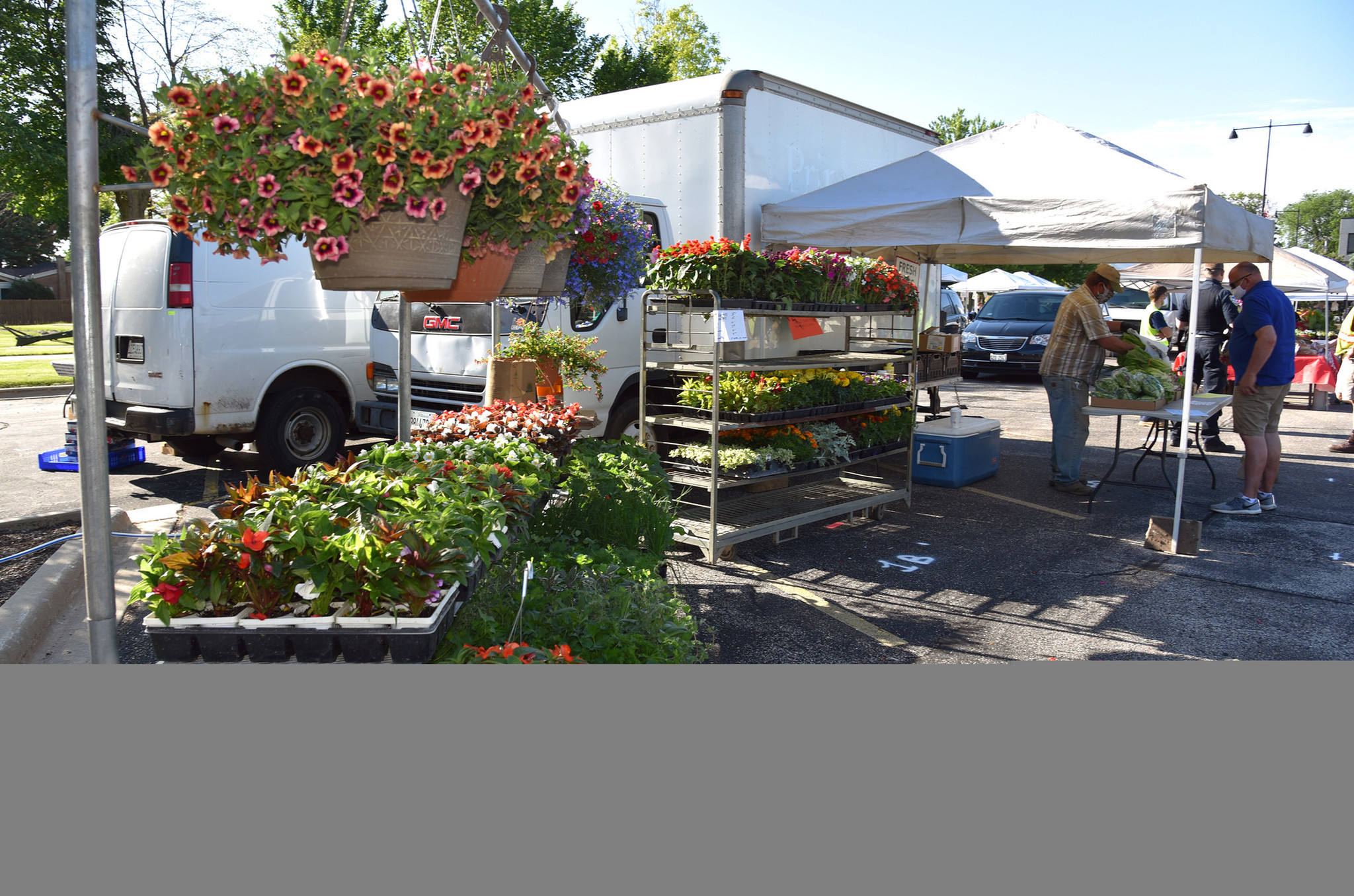 On far right is vendor and farmer John Patyk of Richmond, IL. Patyk grew up in Morton Grove and graduated from Niles West High School. Images from the opening day of the Morton Grove French Market in Morton Grove on June 6, 2020 at 6140 Dempster St.