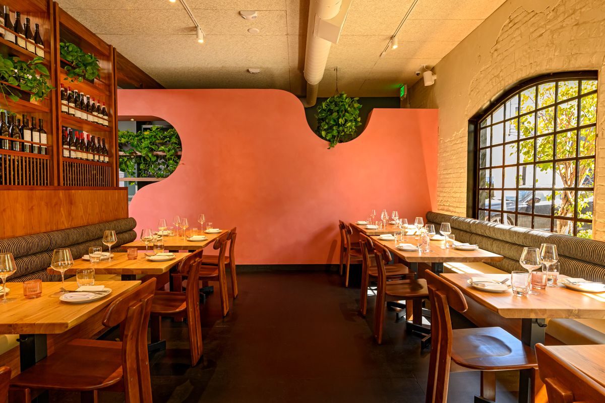 Additional seating next to a wine collection at Attagirl in Hermosa Beach.