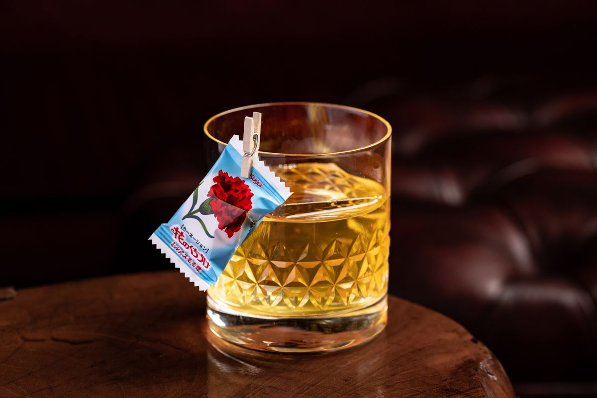 A milk-washed punch with a Japanese candy.