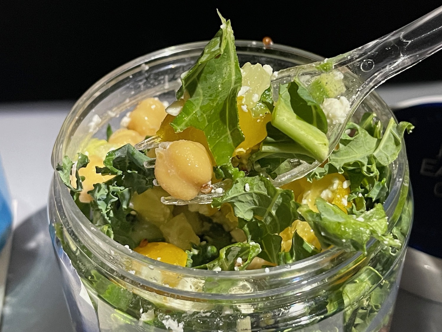 a spoon in a jar of salad