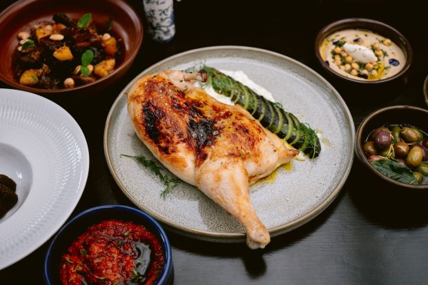 The saffron-marinated, roasted half-chicken at Amara in Belmont is served with charred Persian cucumber and tzatziki. (Courtesy Kristen Loken)