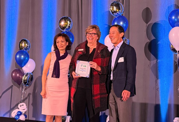 Mary Hoshiko Haughey, center, was presented with a Lifetime Asset Champion award by Project Cornerstone Executive Director Ziem Nguyen Neubert, left, and YMCA of Silicon Valley CEO Jim Hori at a breakfast held at the Santa Clara Convention Center on Friday, March 21, 2025. (Sal Pizarro/Bay Area News Group)