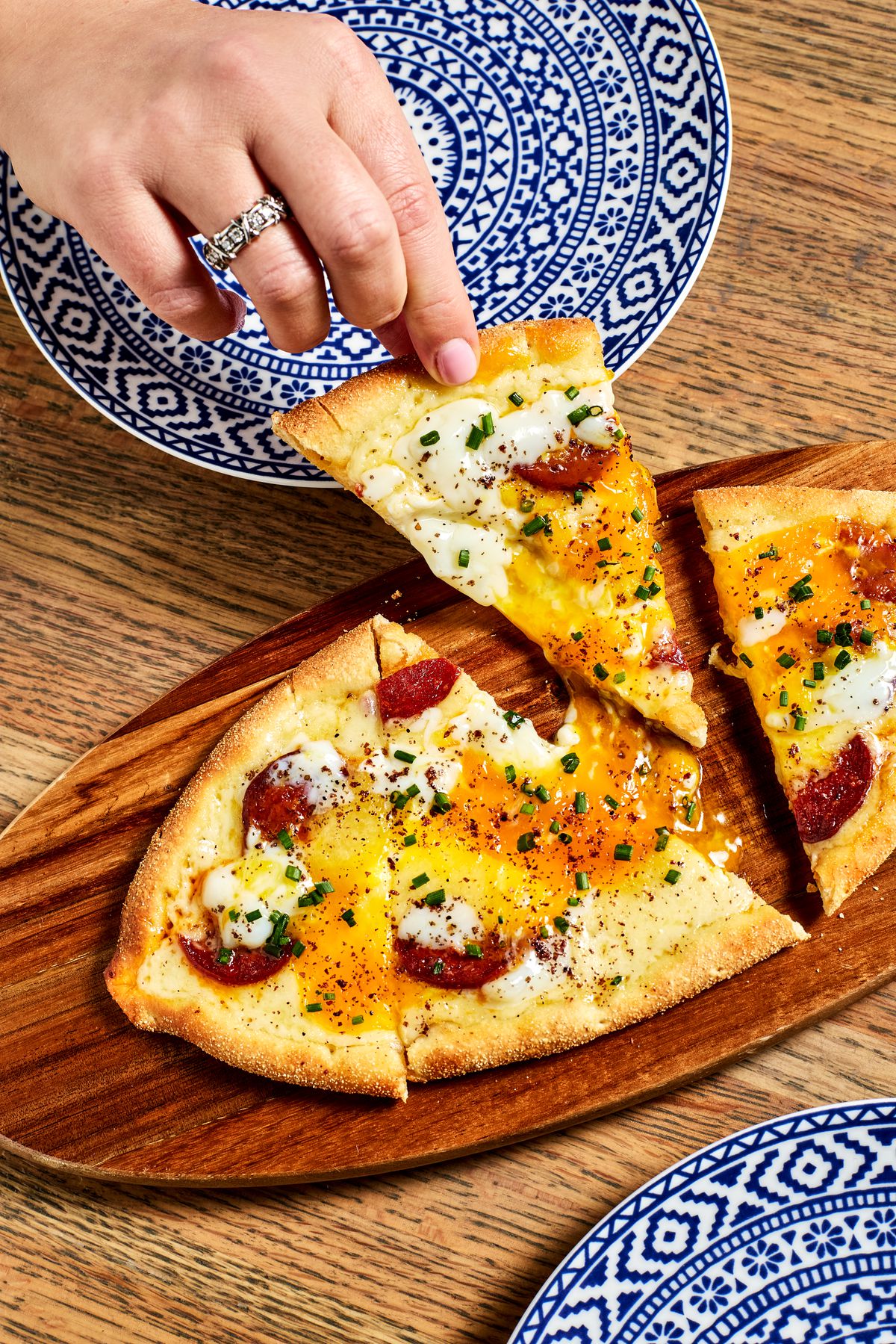 A Turkish flatbread on a wooden board.