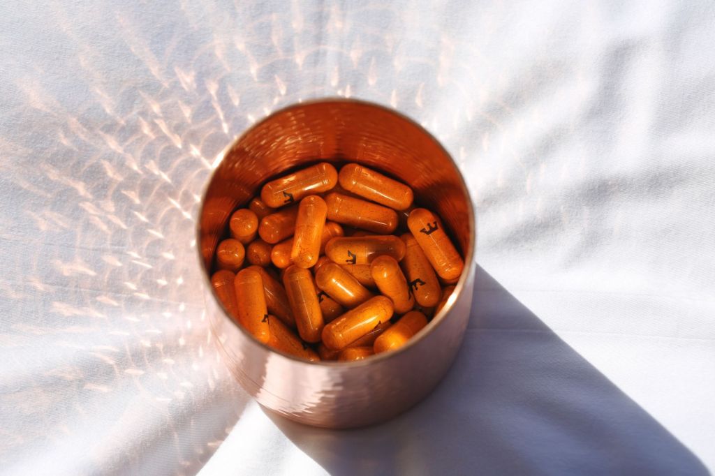 A canister with supplements inside.