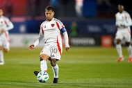 FC Dallas midfielder Luciano Acosta (10) passes the ball during the first half of an MLS...