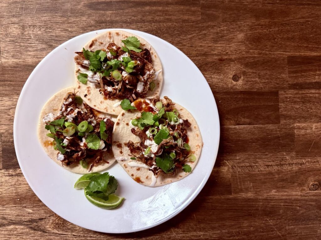 Carnitas, crema, habanero glaze, scallions, cilantro