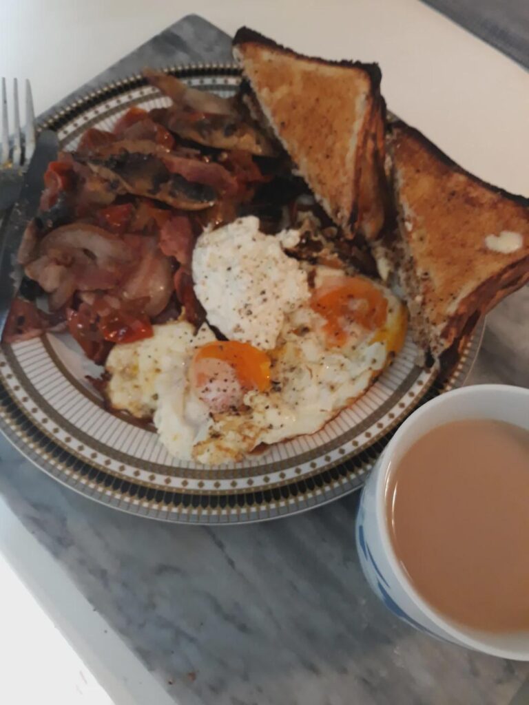 Rate my English Breakfast (tomatoes and mushies are in there I swear -fried them with the bacon - yum!) No beans though, just didn't have any.
