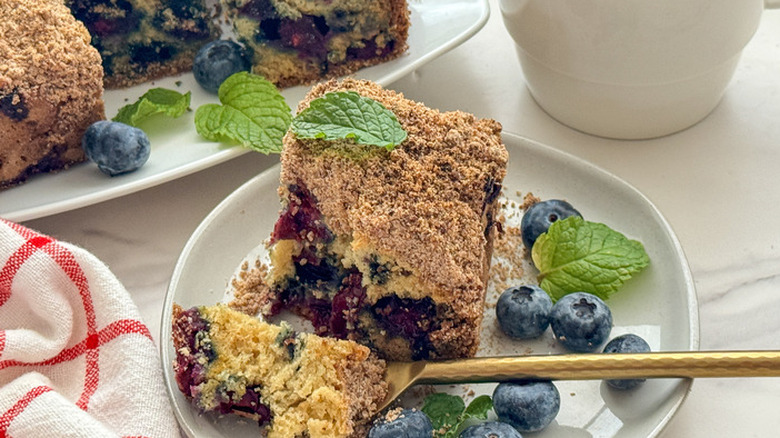 Slice of blueberry coffee cake on plate