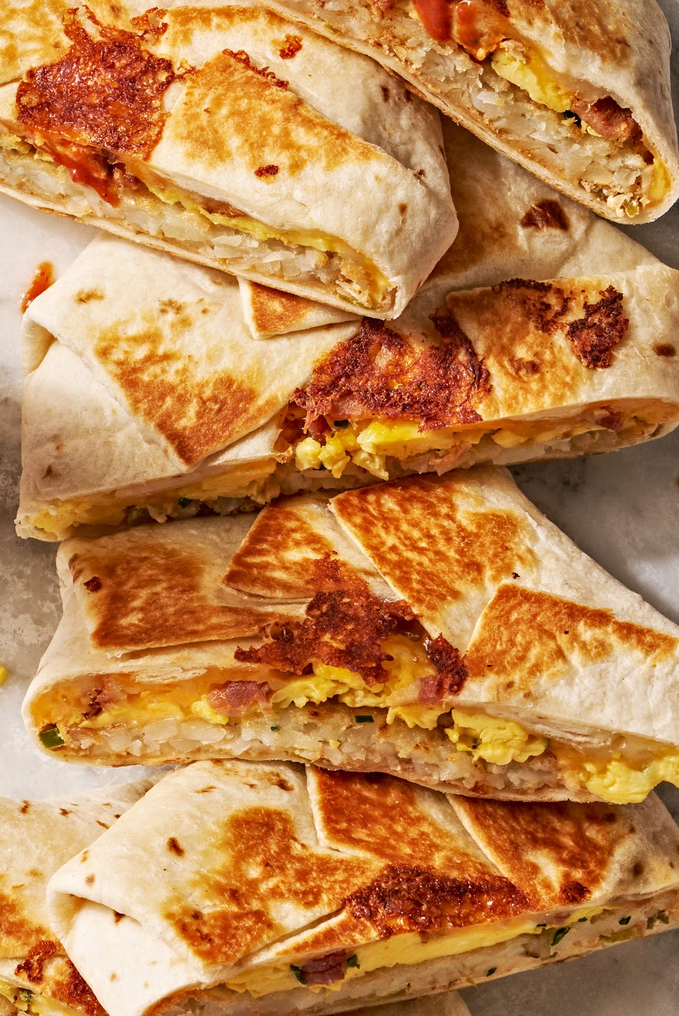 crunchwrap layered with eggs, hashbrowns, and bacon
