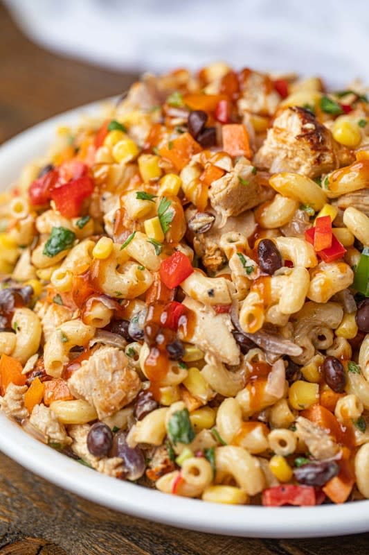 <p>Dinner then Dessert</p><p>BBQ chicken pasta salad with a rich, yummy BBQ mayonnaise sauce, corn, bell peppers, black beans and juicy chicken breast.</p><p><strong>Get the recipe: <a href="https://dinnerthendessert.com/bbq-chicken-pasta-salad/" rel="nofollow noopener" target="_blank" data-ylk="slk:BBQ Chicken Pasta Salad;elm:context_link;itc:0;sec:content-canvas" class="link ">BBQ Chicken Pasta Salad</a></strong></p>