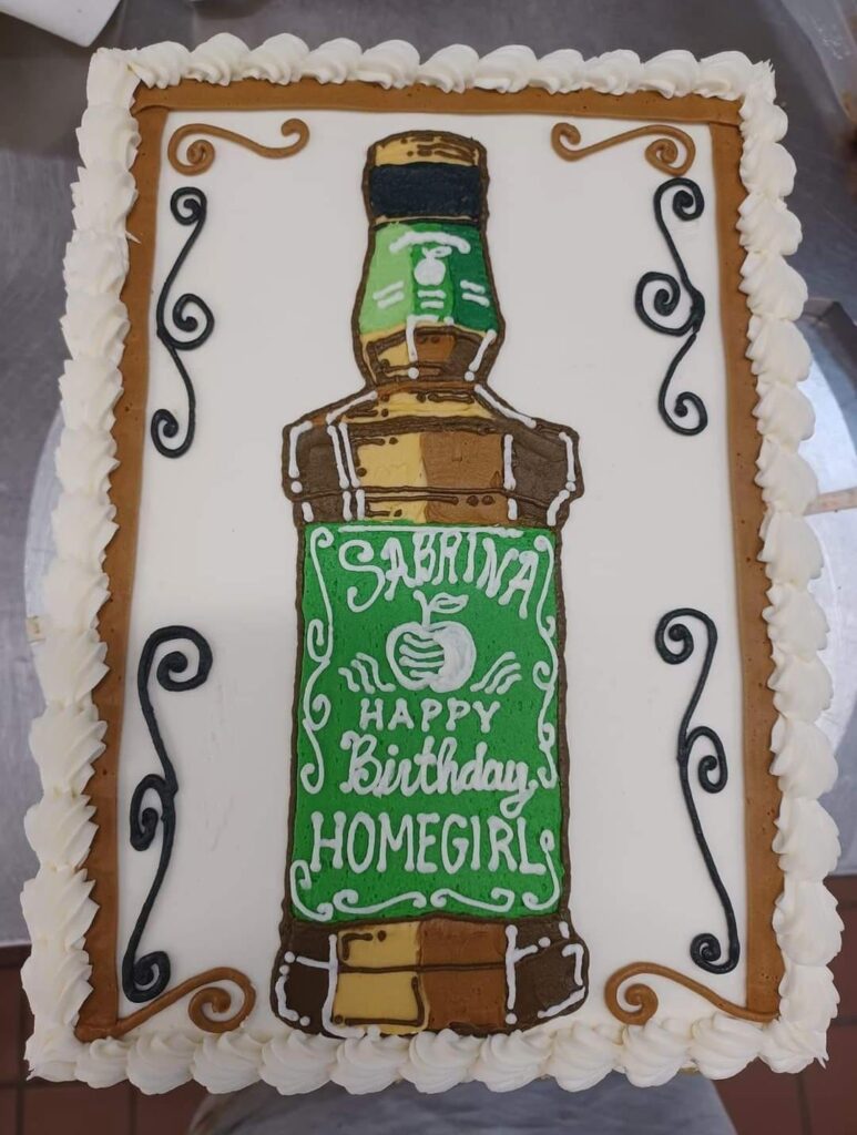 Fairly new to decorating at a local grocery store. Occasionally a customer will ask for something cool. This was for a store manager who was leaving. A bit sloppy, but I like drawing on cakes... however making buttercream look like 'glass' is hard 😕
