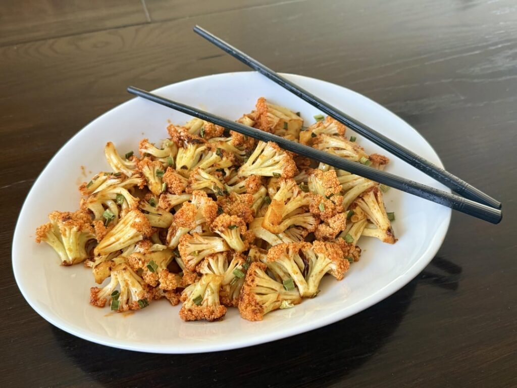 Pan-roasted cauliflower with a drizzle of sweet and spicy maple-lemon-chili pepper sauce.
